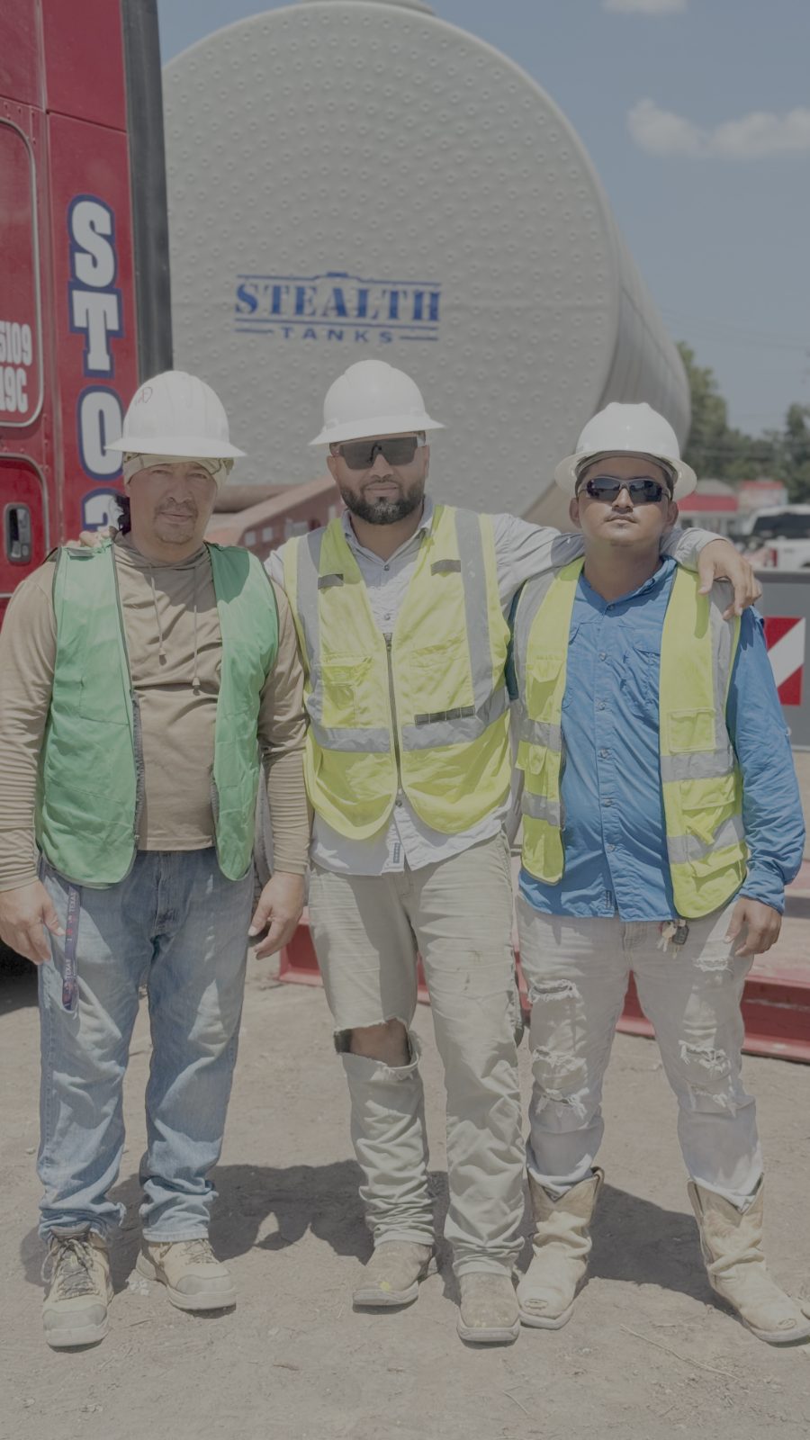 Stealth Tanks crew standing in front of a double-wall underground storage tank on a Houston, Texas job site